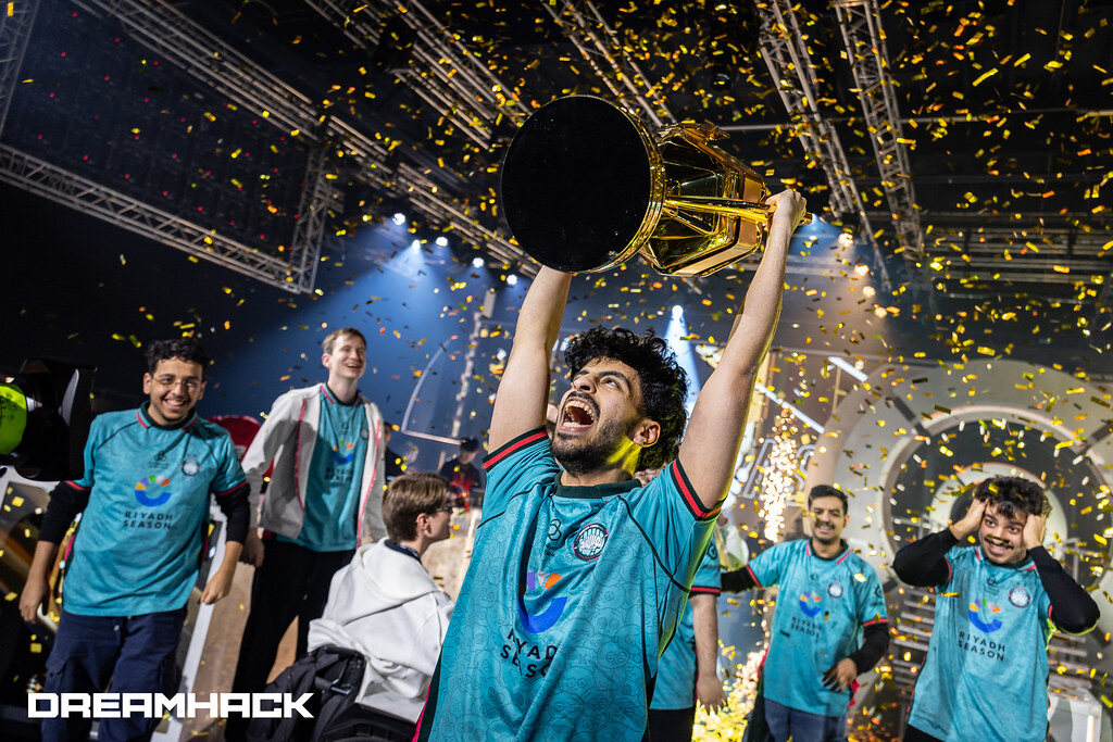 DreamHack Stockholm 2025 winners celebrating with the trophy under gold confetti.