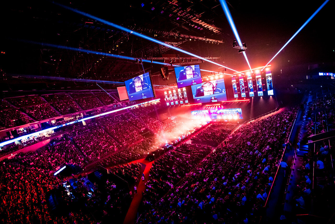 A wide view across the packed IEM Cologne 2022 arena, stage and lighting rig.
