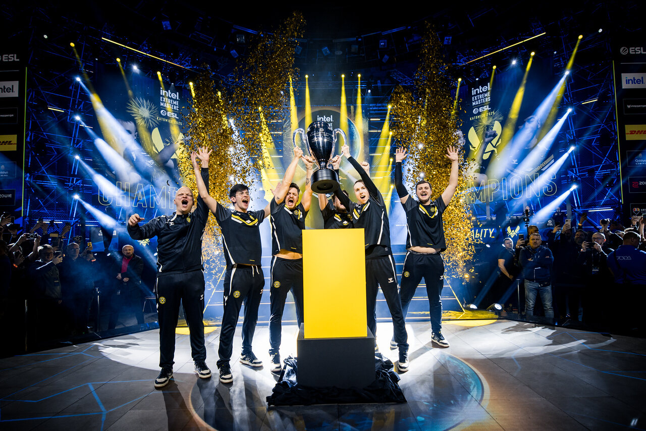 The IEM Katowice 2025 champions celebrating with the trophy and confetti.